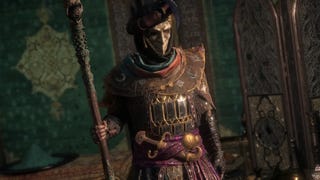 Path of Exile 2 gameplay trailer screenshot showing masked character with a magical staff
