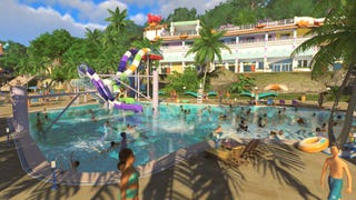 Planet Coaster 2 screenshot showing guests splashing around a busy swimming pool and bursting out of water slides beneath a bright blue sky.